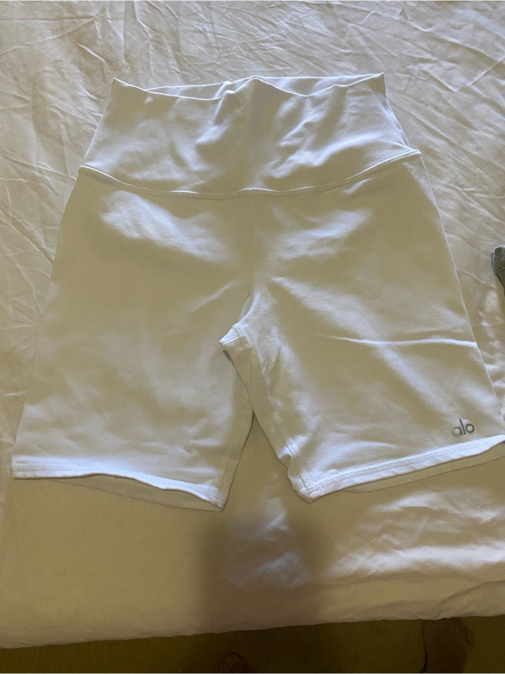 ALO Yoga White High-Waist Biker Shorts and Top.